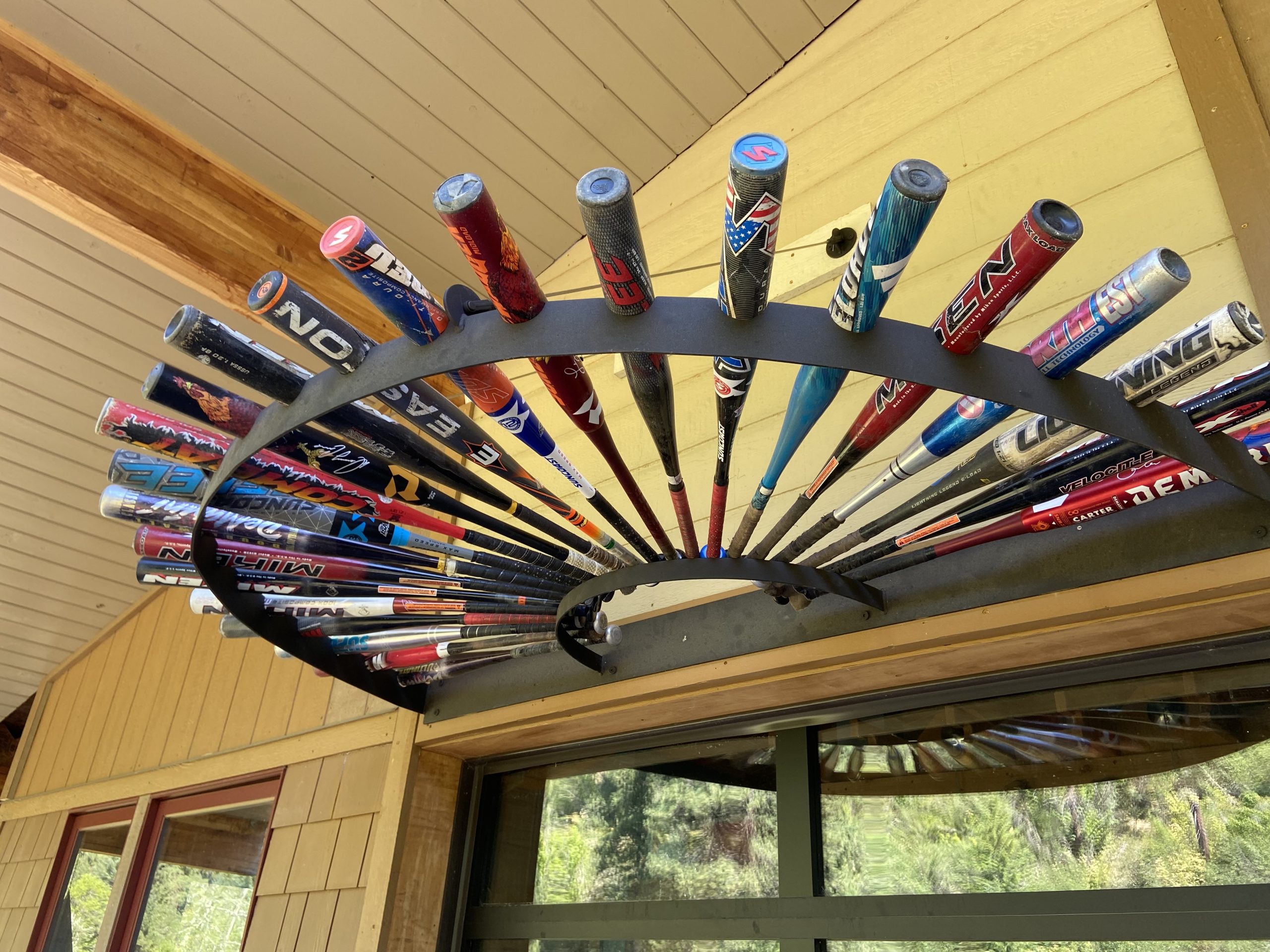 Circular ceiling display rack with baseball bats