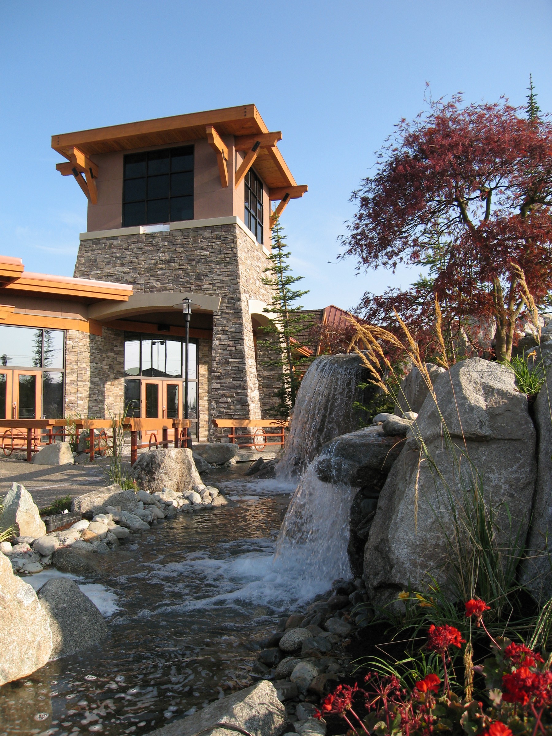 Building entrance with stone waterfall feature